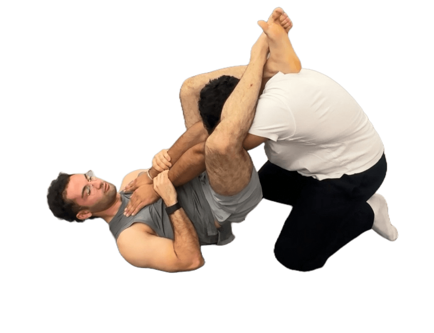 Mohammad grappling on the mat in jujutsu
