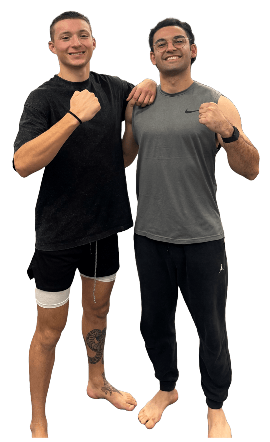 Mohammad standing with a jujutsu partner in gis