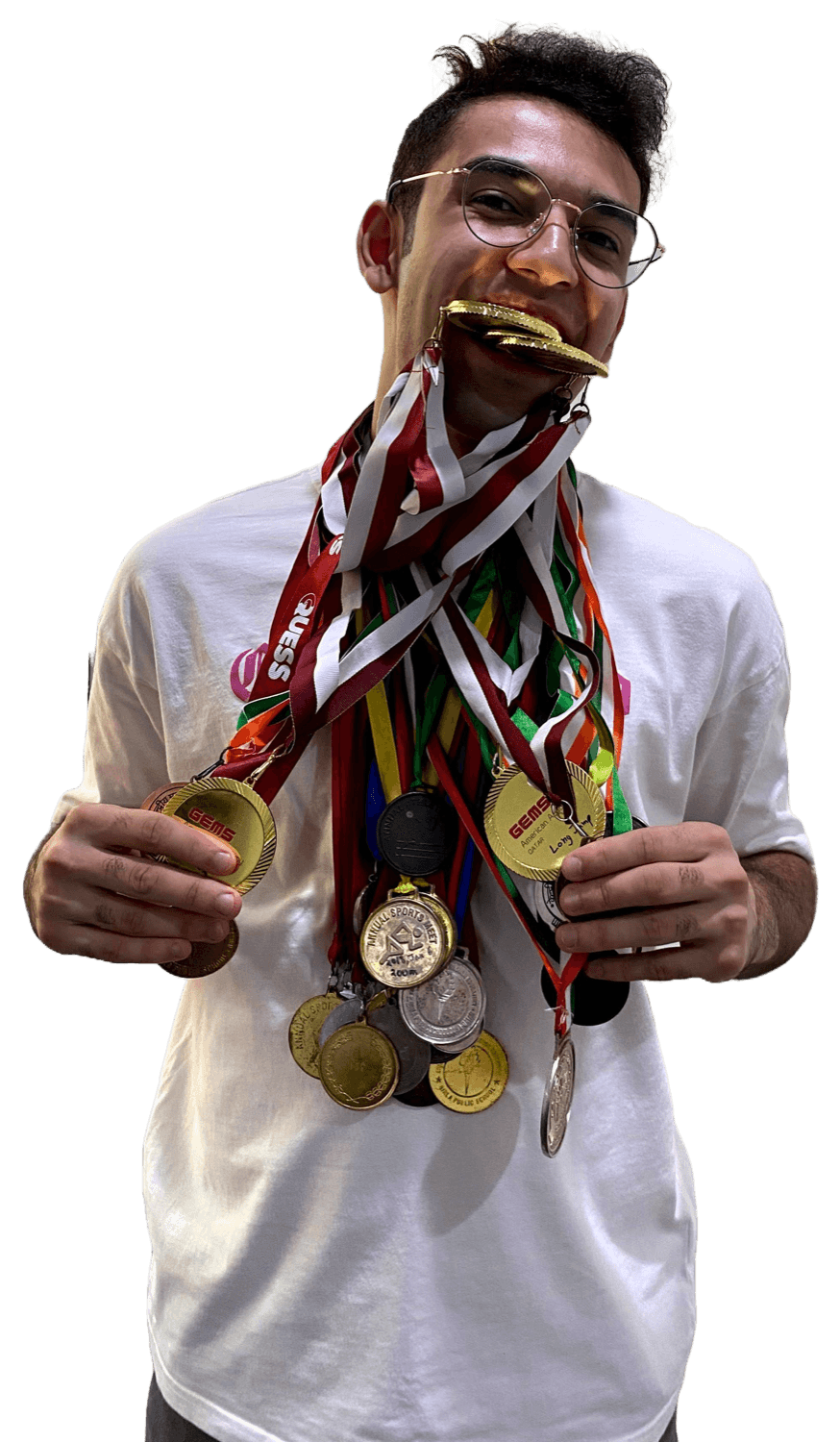 Mohammad holding a display of track and field medals