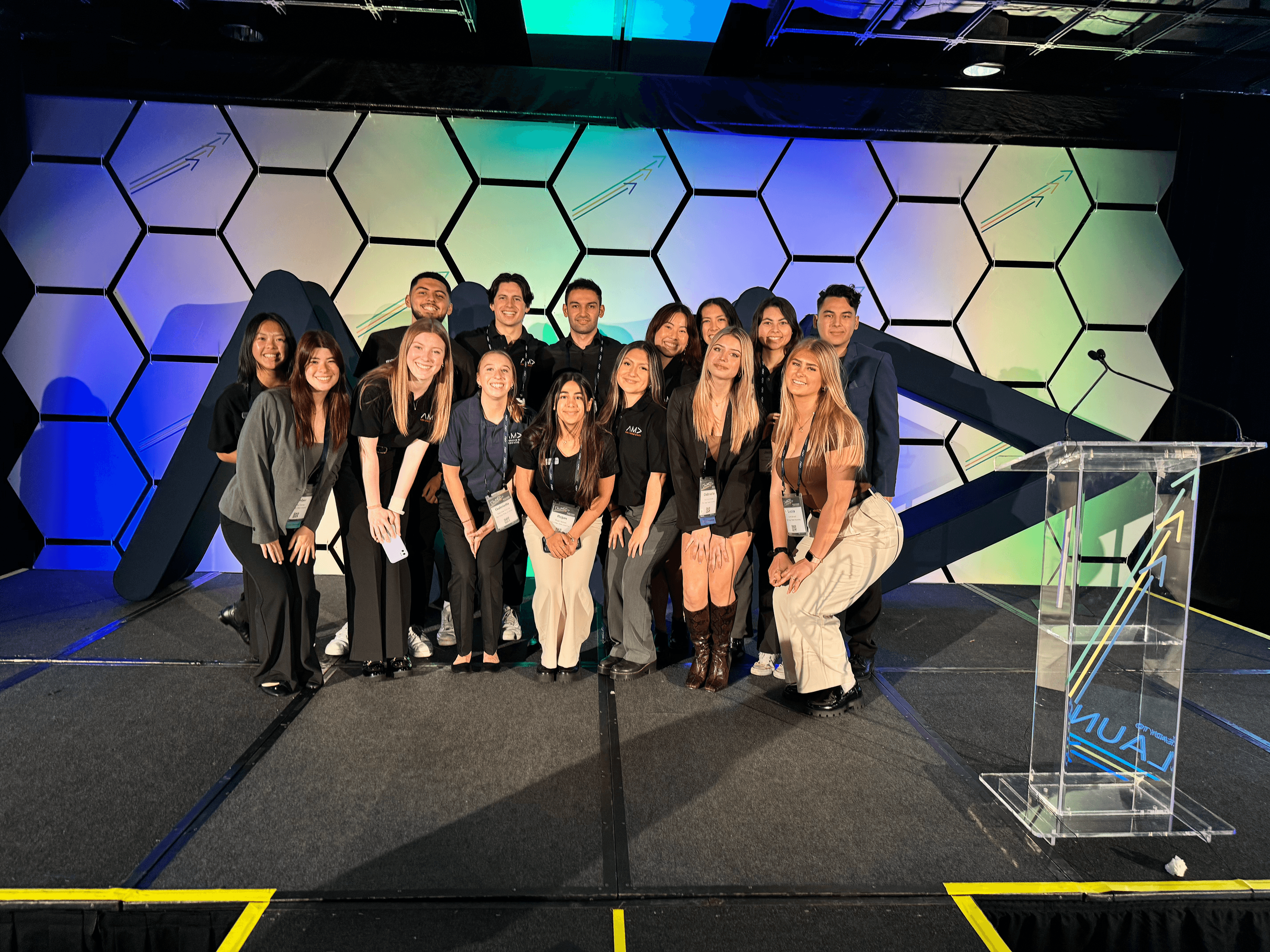 The team together on the conference stage