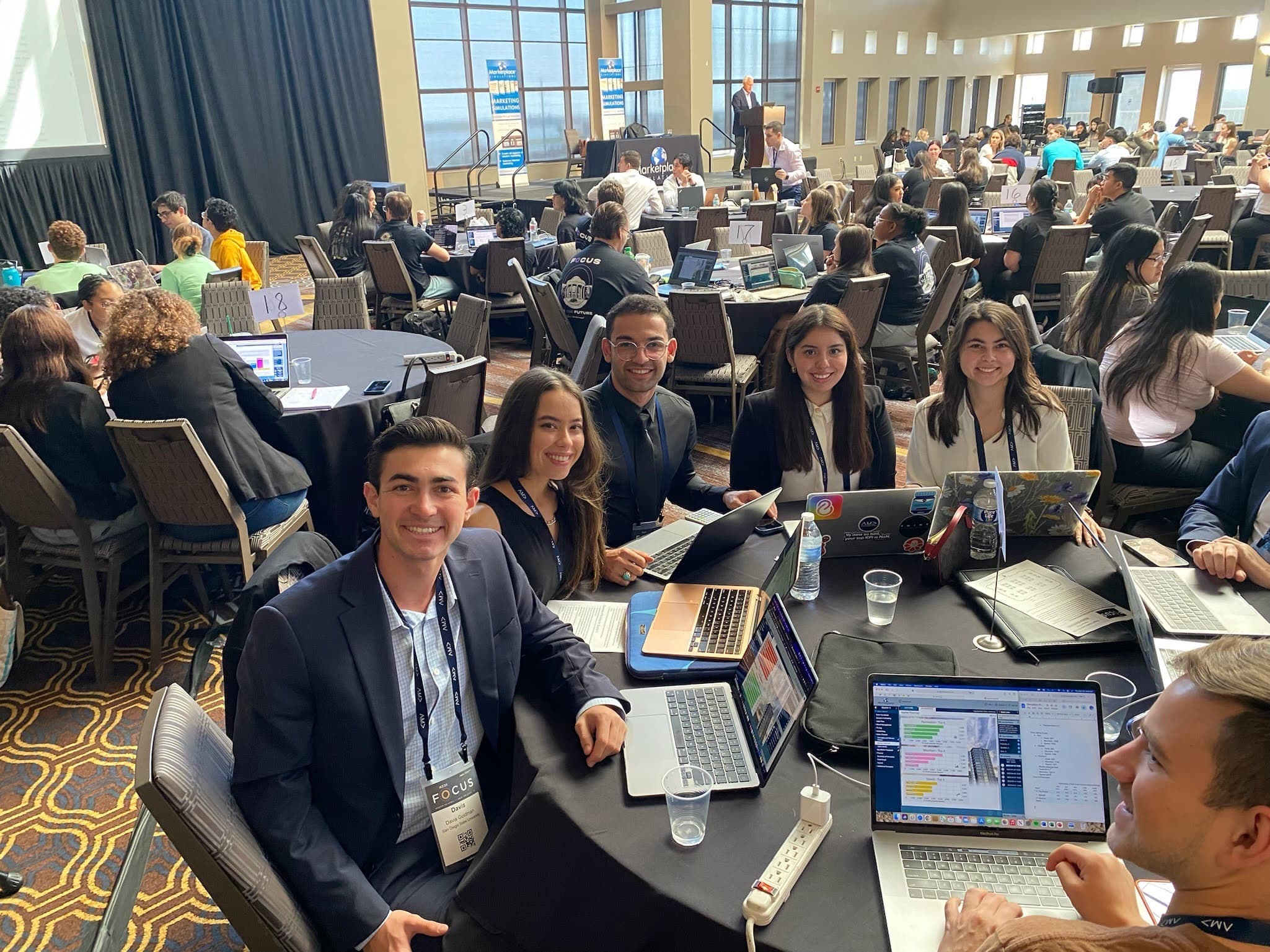 The team at a table on the competition floor